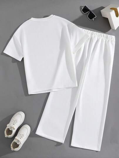 SHEIN مجموعة بنطلون وتيشيرت بأكمام قصيرة وياقة دائرية بتصميم كاجوال وشارع مناسب للمراهقات، مريح ومتعدد الاستخدامات للتنقل والمدرسة والاستخدام اليومي والعطلات والتدريب والحفلات، مناسب للربيع والصيف