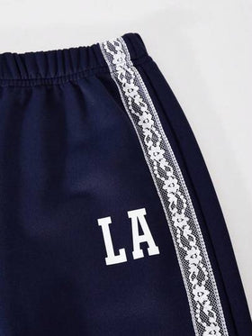 SHEIN ChillGRL طقم بنطلون وتي شيرت للبنات من كاسوفي: تي شيرت بأكمام طويلة وياقة قميص مع تطريز دانتيل، مقترن مع بنطلون واسع الساق مصنوع من الأقمشة المحبوكة مع تطريز دانتيل وطباعة جرافيك، ملابس مناسبة للمدرسة والعطلات، مناسبة للخريف والربيع