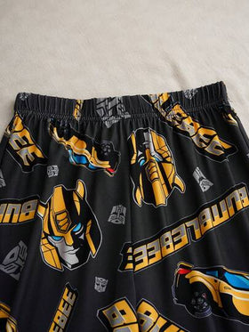 Transformers X SHEIN مجموعة بيجاما مريحة من قطعتين للأولاد المراهقين، تتكون من ملابس علوية بأكمام طويلة وياقة دائرية مطبوع عليها رسومات حرف وروبوت، وبنطلون فضفاض من النسيج المقاوم للاشتعال