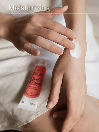 L'Occitane كريم اليد المعطر بحجم السفر بعبير أزهار الكرز المذهلة 10مل/0.34أونصة