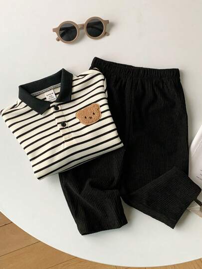 SHEIN مجموعة من قطعتين للأطفال الصبيان/البنات، بلوزة بولو محبوكة بخطوط سوداء وبيضاء ملونة بتباين الألوان وبنطلون من الكوردروي الأسود، ملابس مريحة وأنيقة للاستخدام اليومي، مناسبة للداخل والخارج والرياضة والحفلات وتصوير الصور والأعياد والملابس الرياضية والج