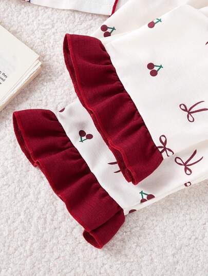 SHEIN مجموعة سترة وبنطلون بأكمام طويلة مطبوعة بالكرز والفيونكة للفتيات الصغيرات، ملابس منزلية مريحة وكاجوال