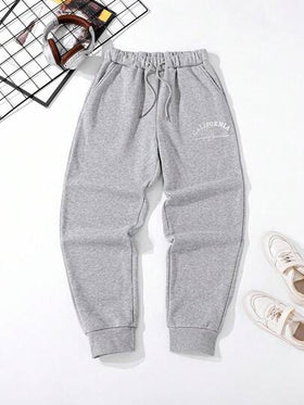 SHEIN Mirajuku بنطلون رياضي مطبوع بتصميم جرافيك فضفاض مناسب للمراهقين الذكور، مناسب للاستخدام اليومي والتنقل والرياضة