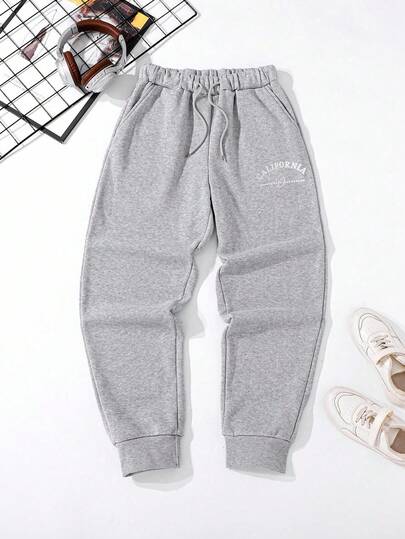 SHEIN Mirajuku بنطلون رياضي مطبوع بتصميم جرافيك فضفاض مناسب للمراهقين الذكور، مناسب للاستخدام اليومي والتنقل والرياضة