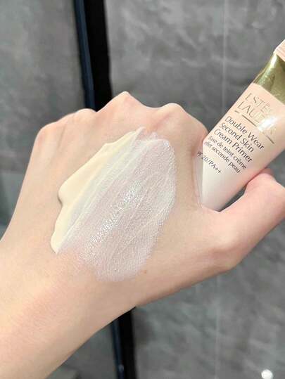Estée Lauder إستي لودر بريمر ميني دبل وير 15مل / ملمس ناعم كالحرير / يقلل من التجاعيد والمسام والعيوب / هذا البوليمر الجديد الناعم يشكل طبقة شفافة مرنة لتحسين نعومة البشرة والتجانس [تغليف عشوائي (نمطان)]