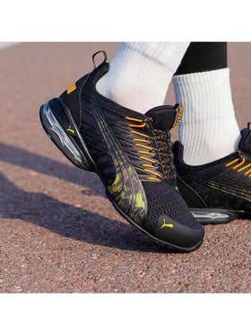 Puma أحذية بوما فولتايك إيفو الرياضية الكاجوال المريحة والمنفذة للهواء، مصنوعة من قماش وجلد اصطناعي، قصيرة الكاحل، مناسبة للجنسين، باللونين الأسود والبرتقالي
