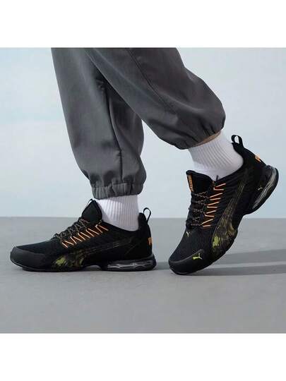 Puma أحذية بوما فولتايك إيفو الرياضية الكاجوال المريحة والمنفذة للهواء، مصنوعة من قماش وجلد اصطناعي، قصيرة الكاحل، مناسبة للجنسين، باللونين الأسود والبرتقالي