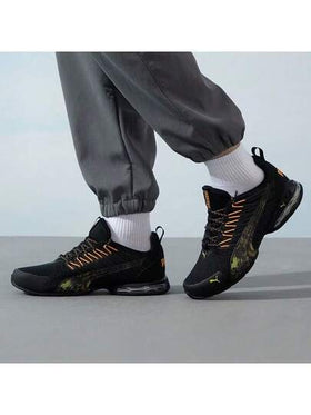 Puma أحذية بوما فولتايك إيفو الرياضية الكاجوال المريحة والمنفذة للهواء، مصنوعة من قماش وجلد اصطناعي، قصيرة الكاحل، مناسبة للجنسين، باللونين الأسود والبرتقالي