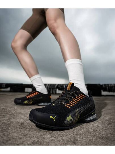 Puma أحذية بوما فولتايك إيفو الرياضية الكاجوال المريحة والمنفذة للهواء، مصنوعة من قماش وجلد اصطناعي، قصيرة الكاحل، مناسبة للجنسين، باللونين الأسود والبرتقالي