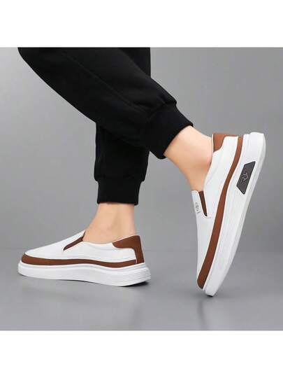 زوج من الحذاء الرجالي الكاجوال سهل الارتداء، بلون أحادي، أحذية رياضية مناسبة للمشي اليومي في الخارج