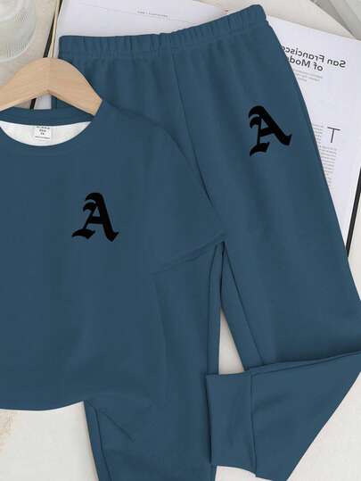 SHEIN طقم ملابس علوية قصيرة الأكمام ذات رقبة مستديرة وبنطلون للأولاد الرضع، طباعة حرف A كلاسيكية بسيطة وعصرية