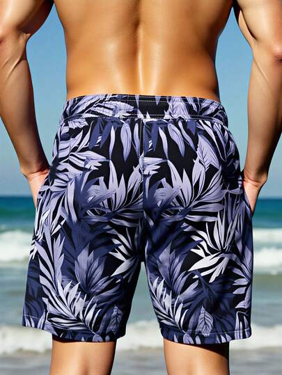 Manfinity Swimmode شورت كاجوال بخصر رباط وجيوب بطبعة نباتات استوائية للرجال