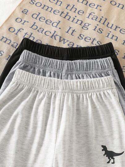 SHEIN Streecool Kids مجموعة 3 قطع من قميص كم قصير وبنطلون مطبوع عليه رسوم ديناصورات للأولاد الصغار باللون الأسود والرمادي والرمادي الفاتح، مناسبة للخروجات والملابس اليومية والرياضة والمناسبات