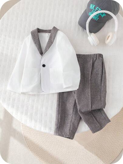 SHEIN مجموعة ملابس طفل ولد بأسلوب جنتلمان جذاب، تتكون من بليزر أبيض وبنطال رمادي كاجوال، مناسبة لحفلات عيد الميلاد والحفلات المسائية والأعراس وحفلات استقبال المولود الجديد وعيد الميلاد الأول، قطعتان