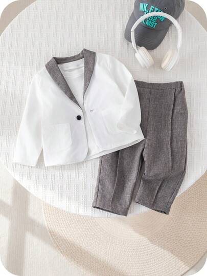 SHEIN مجموعة ملابس طفل ولد بأسلوب جنتلمان جذاب، تتكون من بليزر أبيض وبنطال رمادي كاجوال، مناسبة لحفلات عيد الميلاد والحفلات المسائية والأعراس وحفلات استقبال المولود الجديد وعيد الميلاد الأول، قطعتان