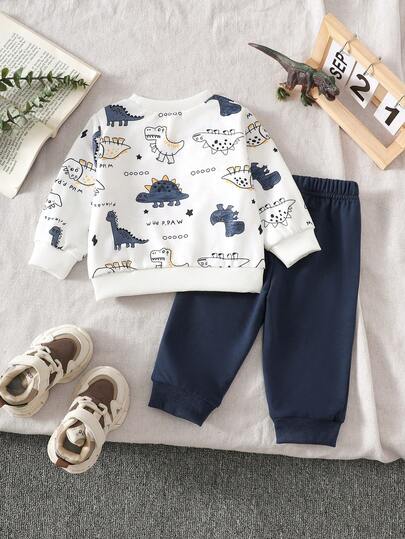 SHEIN Playful Pals مجموعة ملابس علوية بياقة مستديرة بطبعة ديناصور وبنطلون أخضر سادة للأطفال الصبيان، مناسبة للعب في الخارج والملابس الكاجوال والرياضية، للربيع والخريف