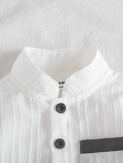 SHEIN Vintaside Kids مجموعة من قطعتين للأولاد الرضع، ملابس علوية بياقة مندرين وأكمام قصيرة مع أزرار وجيوب قصاصة، مقترن مع شورت ذو خصر مطاطي، ملابس كاجوال فضفاضة مريحة، وصول جديد للصيف