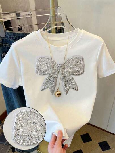 بلوزة بيضاء قصيرة للفتيات والمراهقات، قصة ضيقة، زخرفة فيونكة مزيفة من الراين، متعددة الاستخدامات للارتداء اليومي، مناسبة للربيع والصيف