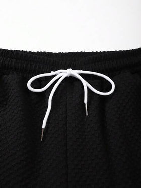 Manfinity Swimmode بدلة شاطئ مكونة من قميص أكمام قصيرة لون سادة وشورت للرجال كبار الحجم