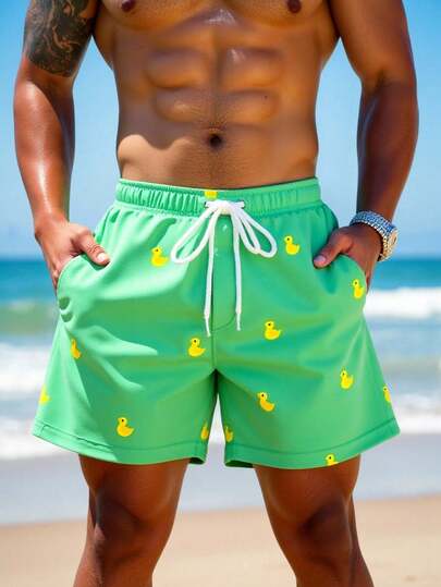 Manfinity Swimmode شورت شاطئ للرجال بخصر مرن مطبوع بطبعات كرتونية وجيوب مائلة