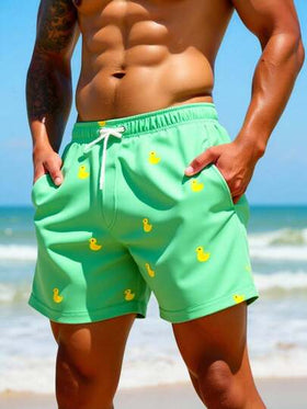 Manfinity Swimmode شورت شاطئ للرجال بخصر مرن مطبوع بطبعات كرتونية وجيوب مائلة