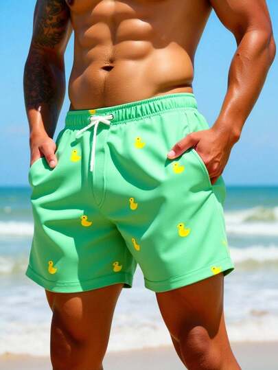 Manfinity Swimmode شورت شاطئ للرجال بخصر مرن مطبوع بطبعات كرتونية وجيوب مائلة