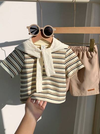 SHEIN 3 قطع مجموعة بونشو مخطط أزرق/وردي للأطفال الصيفية، شورت كاجوال بني فاتح، مناسبة لحفلات عيد الميلاد، الحفلات المسائية، الحفلات، حفلات الزفاف، حفلات استقبال المولود الجديد، احتفال عيد الميلاد الأول