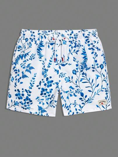Manfinity Swimmode شورت كاجوال متعدد الاستخدامات للشاطئ مع خصر رباط مطبوع بنقشة الزهور للرجال
