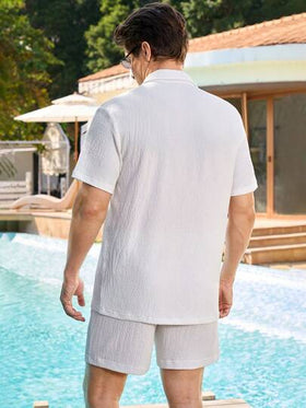 Manfinity Swimmode بدلة شاطئ للرجال مكونة من ملابس علوية أكمام قصيرة لون سادة وشورت خصر رباط