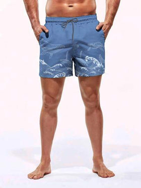 Manfinity Swimmode شورت شاطئ للرجال بخصر مطاطي مزخرف بطبعة الموجة وجيوب