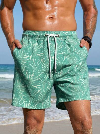 Manfinity Swimmode شورت كاجوال للشاطئ للرجال بخصر مرن وجيوب بطبعة نباتات استوائية