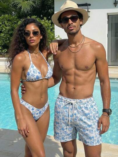 Manfinity Swimmode شورت شاطئ فضفاض بخصر رباط وجيوب مائلة، بطبعة كائنات بحرية على الجميع، لأسلوب الإجازات الصيفية الكاجوال للرجال