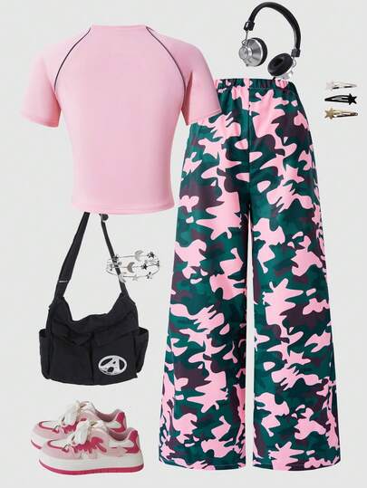 SHEIN مجموعة مكونة من قطعتين للفتيات المراهقات تتميز بتصميم كاجوال وعملي وأنيق، تتكون من تي شيرت مطبوع عليه أرقام وكلمات إنجليزية مع شرائط عاكسة، وبنطلون فضفاض. مناسب للمشي والتسوق والخروجات المدرسية والملابس اليومية. يمكن ارتداؤه مع جاكيت أو سترة.