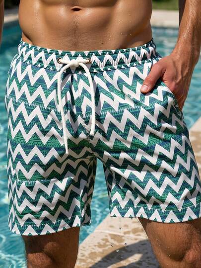 Manfinity Swimmode شورت كاجوال بخصر مطاطي مزين بطبعة الموجات والخطوط للرجال، مناسب للشاطئ