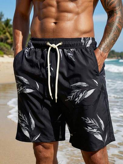 Manfinity Swimmode شورت كاجوال للشاطئ للرجال بخصر مرن وجيوب بطبعة نباتات استوائية
