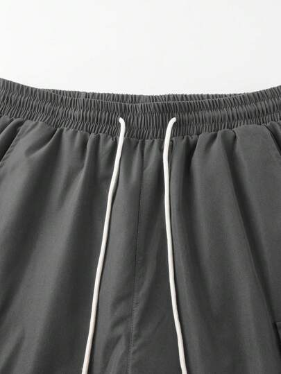 Manfinity Homme شورت رجالي بجيب لون أحادي الخصر بسحاب كاجوال فضفاض، شورت كاجوال رجالي، شورت كارجو للرجال