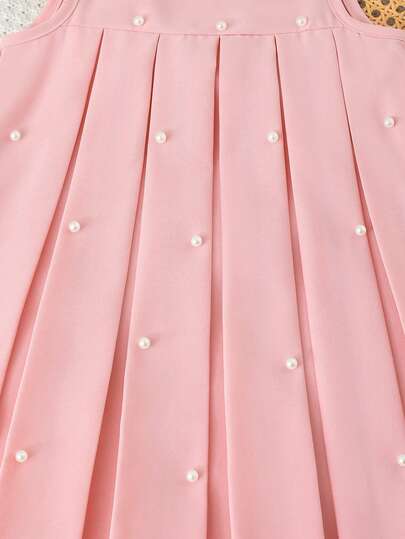 SHEIN فستان كاجوال بدون أكمام للفتاة الصغيرة، مزين بالخرز الاصطناعي وتفاصيل منقوشة، تصميم بسيط وعملي للارتداء اليومي