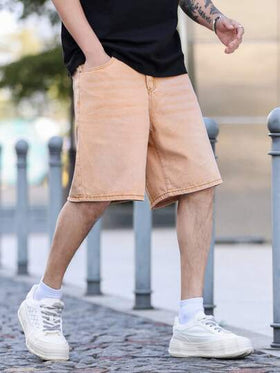 Manfinity Homme شورت جينز فضفاض بجيب مائل بلون أحادي بسيط للرجال للارتداء اليومي والتنقل، صيفي