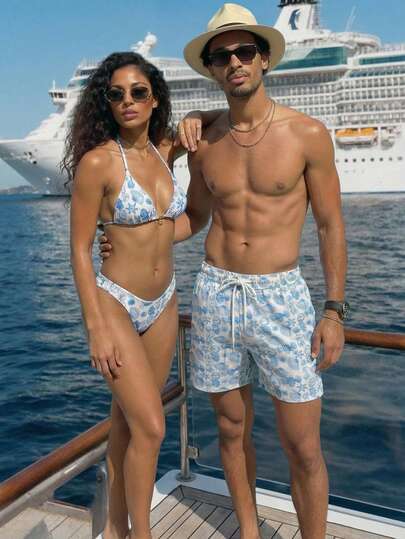 Manfinity Swimmode شورت شاطئ فضفاض بخصر رباط وجيوب مائلة، بطبعة كائنات بحرية على الجميع، لأسلوب الإجازات الصيفية الكاجوال للرجال