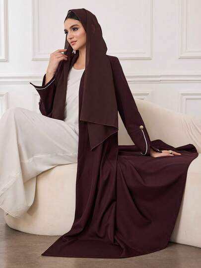 Al Najma عباءة نسائية طويلة الأكمام بتصميم تريم وأزرار ذهبية، مناسبة للارتداء اليومي والتنقل
