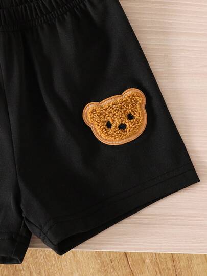 SHEIN Playful Pals مجموعة من قطعتين للأطفال الرضع والصغار، تتكون من سترة مخططة مصنوعة من الأكريليك وقميص بولو أبيض بأكمام قصيرة مزين بشعار الدب، وشورت أسود مزين بشعار الدب، طقم أنيق بأسلوب كاجوال مناسب للارتداء اليومي في الربيع والصيف، مقاس من 6 أشهر إلى