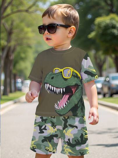 SHEIN Playful Pals طقم أطفال صبية كاجوال عصري جذاب، نظارات شمسية بطبعة ديناصور تيرانوصور، تي شيرت بياقة دائرية وأكمام قصيرة، وشورت كامو بطبعة ديناصور، مناسب للخروجات في الربيع والصيف