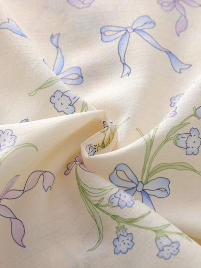 SHEIN مجموعة بنطلون وكارديجان كاجوال مريحة فضفاضة مزينة بطبعة زهرية وفيونكة للبنات، قطعتان