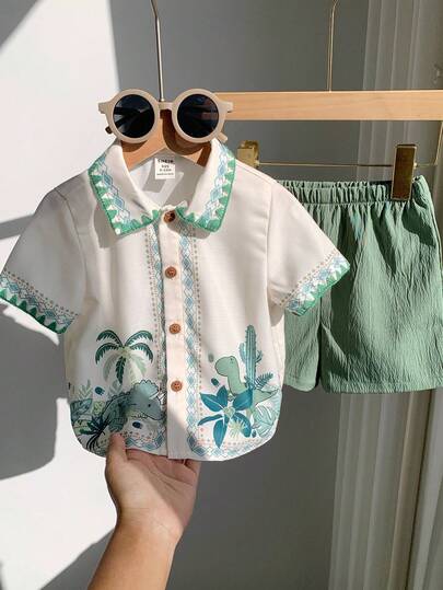 SHEIN مجموعة ملابس علوية وشورت كاجوال للأطفال الرضع الجنسين بطبعة ديناصور جميلة، قصيرة الأكمام، ملابس صيفية للأولاد الرضع، طقم، ملابس علوية أكمام قصيرة، قطعتان