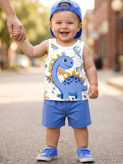 SHEIN Playful Pals مجموعة ملابس عادية للأطفال الصبية، ملابس علوية علوي مطبوع بطبعة ديناصور جميلة مع شورت أزرق، مناسب للارتداء في الخارج صيفًا، 2 قطعة
