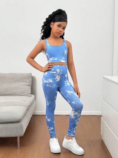 SHEIN مجموعة رياضية للبنات المراهقات تتكون من كامي قصير بتصميم متقاطع في الظهر وسروال ضيق بخصر عالي، مصنوعة من قماش مرن ومريح مناسب للرياضة واليوم الأول للمدرسة