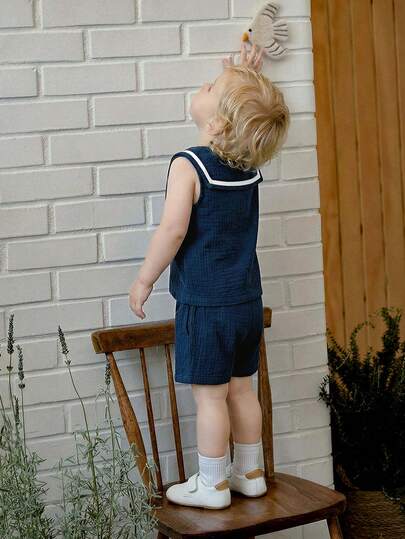 Souflis Souflis مجموعة من قطعتين للطفل الرضيع الولد، تتكون من ملابس علوية بياقة بحرية بدون أكمام مع شورت كاجوال متعدد الاستخدامات، مناسبة للمدرسة والمنزل واللعب وغيرها من المناسبات