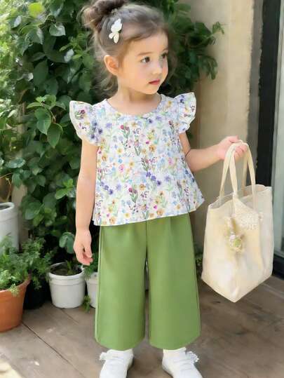 Elladie kids ملابس جديدة مكونة من قطعتين للفتيات الصغيرات بعمر 4-7 سنوات، تتميز بقميص مطبوع بأكمام قصيرة مع أزرار خلفية ومطابق له بنطلون، أنيقة ومناسبة للأنشطة اليومية والعطلات والمدرسة والسفر والأنشطة الخارجية