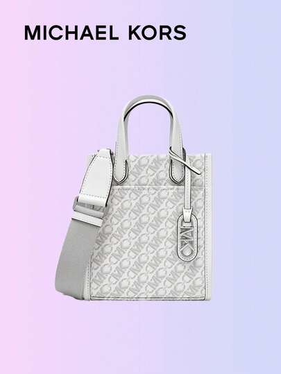 Michael Kors حقيبة كروسبودي صغيرة، تصميم جاكارد أنيق، نمط معقود بشكل معين، رمادي داكن، فاخرة ومتينة، مثالية للاستخدام اليومي. حقيبة يد عصرية مع حزام كتف قابل للتعديل، مصنوعة بعناية، داخل فسيح، مثالية لتخزين الضروريات.