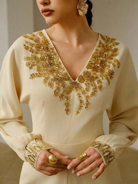 ZEYLAH جمبسوت كاجوال للنساء مزينة بالترتر والزهور على الرقبة على شكل حرف V